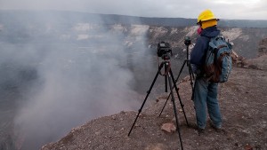 Geologist in mask overlooking Halemaumau_property of Ben Gaddis