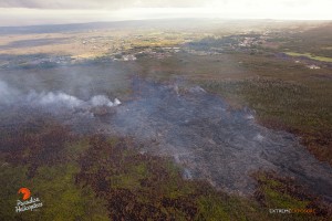 This photo taken on Jan. 14 shows a branch from the flow that threatened the Pahoa Marketplace, that was active and slowly approaching the firebreak Tuesday. The flow's outer edges continue to expand as well. Photo: Extreme Exposure Media/Paradise Helicopters.
