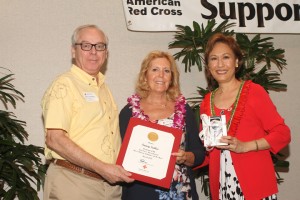 Steve Tabussi (First Insurance Company of Hawaii), Nancy Sallee (Kona Volunteer of the Year), Coralie Matayoshi (CEO of the Hawaii Red Cross). Hawai'i Red Cross photo.