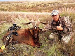 Lloyd Rubio is shown with a goat he shot hunting in the Saddle Road area on Nov. 17. Photo courtesy of US Army Garrison Pohakuloa.