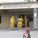 Firefighters prepare to ventilate the Territorial Savings Bank. Photo by Dave Smith.