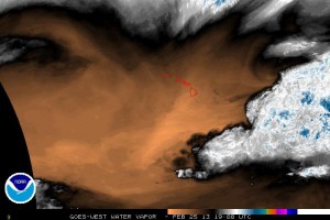 This satellite image taken at 9 a.m. today shows the mass of water vapor has moved far to the east of the Big Island. NOAA image.