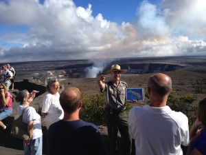 Park Ranger Dean Gallagher engages visitors with a “Life on the Edge” talk, held daily at the Jaggar Museum Overlook in Hawai'i Volcanoes National Park. NPS Photo