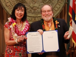 Gov. Neil Abercrombie is accompanied for the bill signing by Karen Korematsu, daughter of the late Fred Korematsu, one of the Japanese-Americans prosecuted for refusing to report to an internment camp.  She is also co-founder the Fred T. Korematsu Institute for Civil Rights and Education.