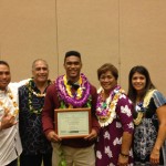 KS-Hawai`i graduate Shaun Kagawa (middle) is flanked by family at Sunday's ceremony. Photo by Josh Pacheco.