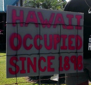 This sign is posted on the fence in front of Kale Gumapac's Hawaiian Paradise Park Home. Photo by Hunter Bishop