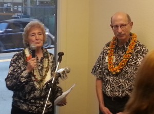 Immigrant Resources Center Coordinator Linda Spencer, left, and Catholic Charities Hawaii CEO Jerry Rauckhorst speak during today's dedication. Photo by Dave Smith.