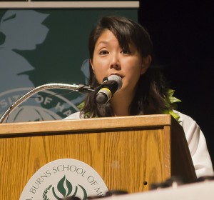 Dr. Melani Arakaki, shown addressing new medical students at a recent ceremony, is a Hilo-area native who decided to practice medicine locally after graduating from UH's Family Medicine Residency Program. JABSOM photo.