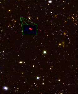This image from the Hubble Space Telescope CANDELS survey highlights the most distant galaxy in the universe with a measured distance. The galaxy's red color alerted astronomers that it was likely extremely far away, and thus seen at a time not long after the Big Bang. Photo by V. Tilvi, S.L. Finkelstein, C. Papovich, A. Koekemoer, CANDELS, and STScI/NASA.