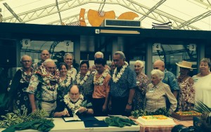 Gov. Neil Abercrombie, flanked by former and current West Hawaii lawmakers --  including outgoing Rep. Denny Coffman (bedecked in lei to Abercrombie's right) -- signs new rules designed to protect West Hawaii marine resources. Courtesy photo.