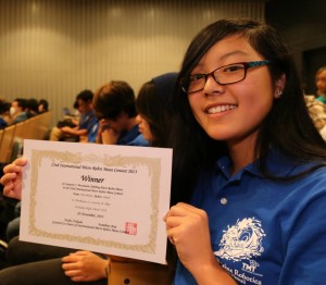 Erin Morikawa shows the certificate awarded for her team's first-place showing in the Mountain Climbing Micro Robot Maze. Courtesy photo.