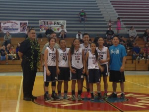 The Stingrays 14 and under girls basketball team takes its championship photo after defeating Wahine Ryders. Photo by Josh Pacheco.