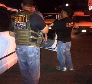Some of the members of the federal task force during this morning's arrest. US Marshals photo.
