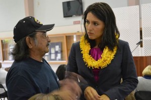 Rep. Tulsi Gabbard talks with a veteran on Kauai during her "Veterans Listening Tour" last week. Courtesy photo.