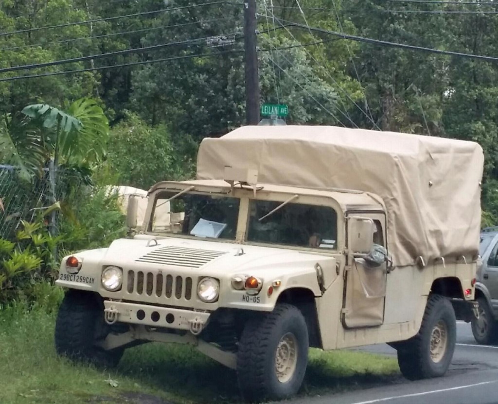 A Humvee from the Hawai`i National Guard sits along the side of a road in Hawaiian Paradise Park. Photo by Kristin Hashimoto.