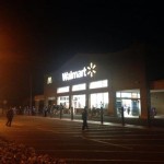 Walmart employees remained outside of the store hours after a clothing fire closed it down Tuesday afternoon. Photo credit: Josh Pacheco.