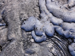 A closer look at the blue glassy type of pāhoehoe, whose color stands out from the more typical black lava surface on the left side of the photo taken on Jan. 29. For scale the photograph width is about two meters (yards). HVO photo.