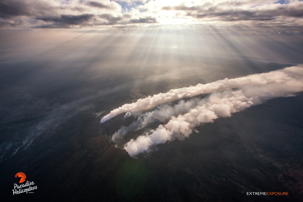 This photo taken on Jan. 16 shows a Northerly wind blowing the plume rising out of Pu‘u ‘O‘o crater to the south, while the voggy and smokey air is illuminated by the crepuscular rays of sunshine. Photo: Extreme Exposure Media/Paradise Helicopters.