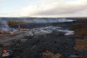 This photo taken on Jan. 22 shows a substantial breakout that was active about 4 miles downslope of Pu‘u ‘O‘o crater, spilling lava in the middle of the flow field. Photo credit: Extreme Exposure/Paradise Helicopters.