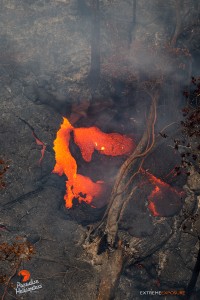 In this photo taken on Feb. 9, a fresh breakout near the stalled flow front pours lava into a depression. Photo credit: Extreme Exposure Media/Paradise Helicopters.