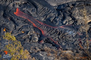 In this photo, taken Feb. 16, activity picked up a little, as a finger of lava on the southern margin of the Pahoa Marketplace flow, advanced about 100 yards the two days prior. Photo credit: Extreme Exposure Media/Paradise Helicopters.