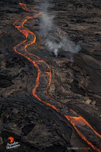 This photo, taken Feb. 23 at 6 p.m., shows a long river of lava snakes down the north flank of Pu‘u ‘O‘o. Photo credit: Extreme Exposure Media/Paradise Helicopters.