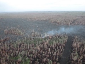 This image taken Feb. 13 during Hawai’i County Civil Defense’s morning overflight shows surface activity and burning along the edges near fire break. Civil Defense photo.