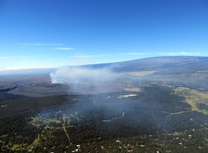 The winds on Feb. 19 were carrying the gas plume from Halemaʻumaʻu towards the northeast. Volcano Village is in the bottom portion of the photograph and Mauna Loa is in the upper right. USGS HVO photo.