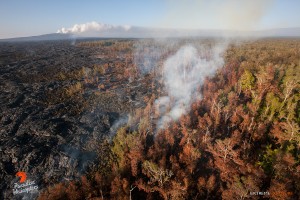 In this photo, taken Feb. 16, a few hot spots continue to expand the flow field just upslope of the Pahoa Marketplace. Photo credit: Extreme Exposure Media/Paradise Helicopters.