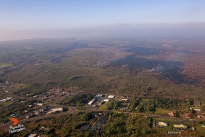 This photo, taken Feb. 16, shows a few hot spots that continued to expand the flow field just upslope of the Pahoa Marketplace. Photo credit: Extreme Exposure Media/Paradise Helicopters.