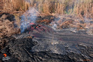 In this photo, taken Feb. 23 at 8 a.m., a large breakout, about a half mile downslope of the old geothermal pad, poured lava onto the middle of the flow field. Photo credit: Extreme Exposure Media/Paradise Helicopters.