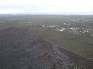 This photo, taken March 16, shows s view from the south flow margin, looking downslope towards Highway 130 and Pahoa Marketplace. Hawai'i County Civil Defense photo.