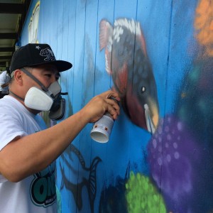 Oahu-based multimedia artist, East-3, placed the final touches on the latest installation of the Not Even Once Mural Project, an initiative focused on bringing large-scale anti-meth murals to schools across the state. Photo credit: Keep It Flowing LLC.