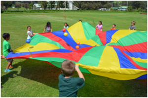 Parker students enjoy playing with a parachute at the school’s Jump Rope for Heart event. Parker School photo.