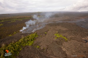 This photo, taken April 24, shows  a new branch of lava breaks off from the main flow to the east. Pu‘u ‘O‘o sits in the upper right of the frame. Photo credit: Extreme Exposure Media/Paradise Helicopters.