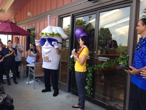 A company official and the Coffee Bean and Tea Leaf mascot at the grand opening of the Kea'au location of The Coffee Bean & Tea Leaf. Photo credit: Jamilia Epping. 