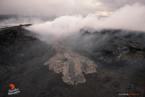 A breakout from an opening along the eastern wall (bright spot), spilled lava onto the crater's floor on the morning of May 6. Photo credit: Extreme Exposure Media/Paradise Helicopters.