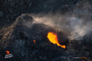June 11: One of the spatter cones within Pu‘u ‘O‘o crater spitting bits of lava. Photo: Extreme Exposures Media/Paradise Helicopters. 