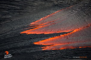 June 11: The trailing edge of a fresh breakout cools, forming finger-like protrusions, floating on the river of molten lava. Photo: Extreme Exposure Media/Paradise Helicopters. 