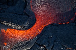 June 25:  A breakout from the top of a tube sends lava over both sides of its raised roof.  Photo: Extreme Exposure Media/Paradise Helicopters.