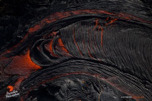 June 4: The crusted surface of a river of lava breaks apart as it picks up a little speed and flows down a slope. Photo: Extreme Exposure Media/Paradise Helicopters.