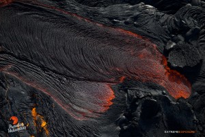 June 4: Lava pours out of a tube and feeds the river. Photo: Extreme Exposure Media/Paradise Helicopters.