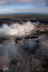 June 25:  The collapse pit within Pu‘u ‘O‘o crater still contains a sloshing lava pond, but rising gas plumes obscured most of it while we were over it.    Photo: Extreme Exposure Media/Paradise Helicopters.