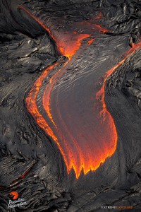 July 9: The surface of this pahoehoe breakout is cooling from the moment it exits the tube, creating wrinkles in its shiny surface.  Photo: Extreme Exposure Media/Paradise Helicopters.