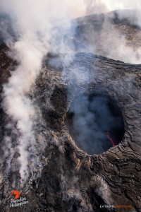 Aug. 6:  With the winds blowing from the south, we had the rare opportunity to fly directly over the collapse pit within Pu‘u ‘O‘o crater, and watch the lava pond consume hardened plates of its cooled surface in the subduction zone along its edge.  Photo: Extreme Exposure Media/Paradise Helicopters.
