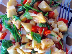 Breadfruit “Ulu” Home Fries with onions, peppers and arugula. Photo credit: Kristin Frost Albrecht.