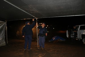 Department of Land and Natural Resources officials take down a tent that was set up across from the Mauna Kea Visitor Center. DLNR photo.