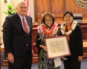 Chief Justice Mark Recktenwald (left) and Associate Judge Lisa Ginoza (right) congratulate Hattie Embernate, Fiscal Office, Office of the Court Administrator, Third Circuit (center), recipient of the Judiciary’s 2015 Distinguished Service Award. Hawai'i State Judiciary photo.