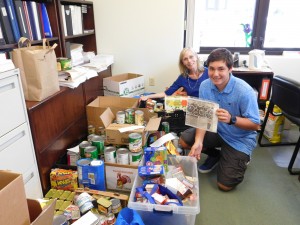 Makana Watson and Judy Donovan inventory donated food items. Kona Community Hospital courtesy photo.