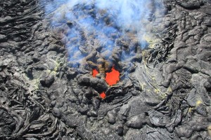 A bubbling lava surface could be seen about 5 m (16 ft) below the opening of the new vent when viewed from the air. The size of the opening will likely grow with time, as the narrow septa between the individual holes collapse. HVO photo, taken on Dec. 17.
